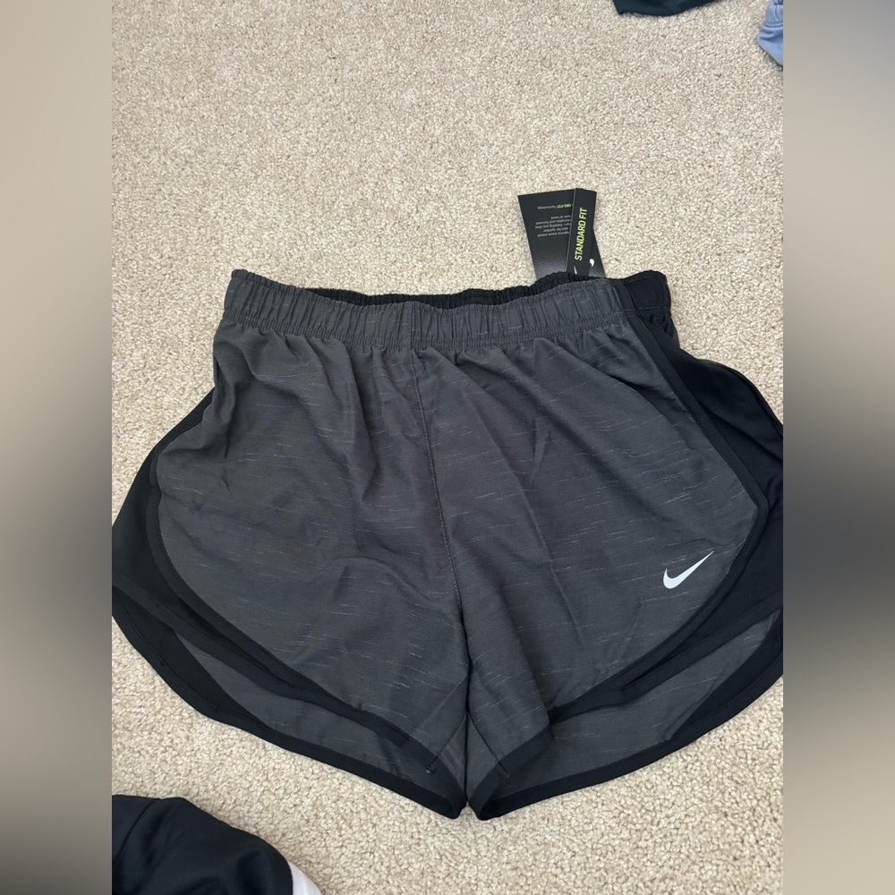 Women’s athletic Nike dri fit gray black running shorts small. NWT.